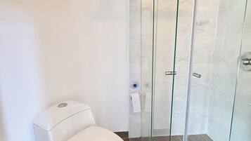 Standard Studio | Bathroom | Shower, towels, soap, toilet paper