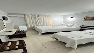 Family Triple Room, Garden View | Desk, laptop workspace, free WiFi