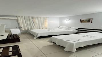 Family Triple Room, Garden View | Desk, laptop workspace, free WiFi