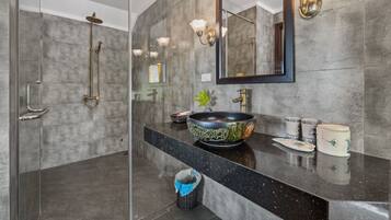 Shower, free toiletries, hair dryer, slippers