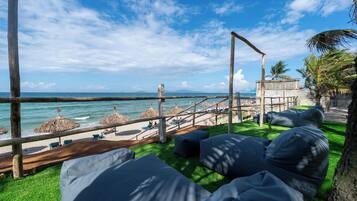 On the beach, white sand, free beach cabanas, sun loungers