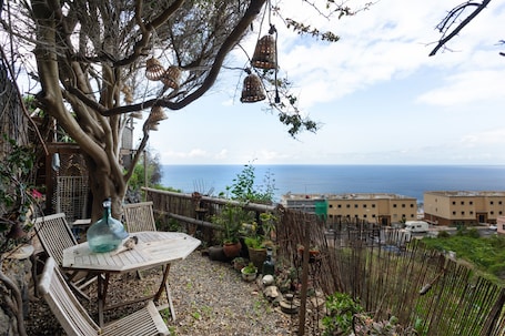Outdoor dining. Vacation Home 'Casa Afrikika' with Sea View, Private Terrace and Wi-Fi