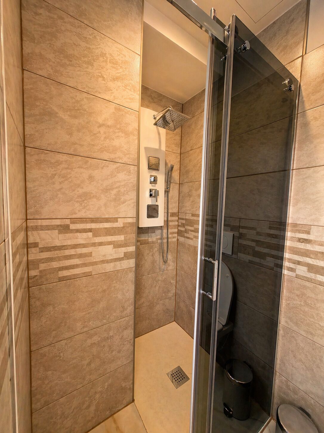 Shower, towels, soap, toilet paper