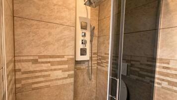 Shower, towels, soap, toilet paper