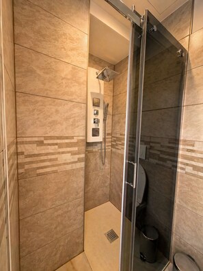 Shower, towels, soap, toilet paper