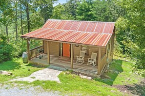 A rustic cabin with a porch, two rocking chairs, and a grill. - Dreamy Mountaintop Escape for Two | Sauna & Views (Blue Ridge)