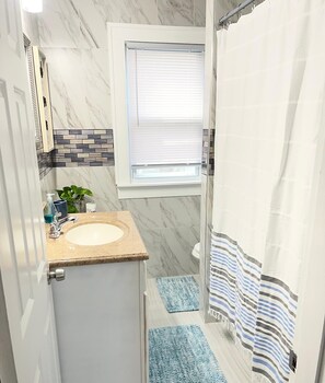 Hair dryer, towels, soap, toilet paper