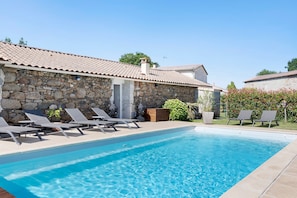 A stone building with a tiled roof, a swimming pool, and lounge chairs. - Guest Room 'Eléonore - Aux Charmes D’antan' with Shared Pool, Terrace, and Wi-Fi (Sèvremont)