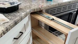 A kitchen with white cabinets, a wooden countertop, and a built-in oven. - Fabulous 3-bedroom farmhouse in charming Weirsdale (Weirsdale)