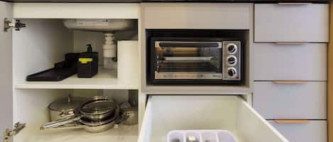 Fridge, microwave, coffee/tea maker, cookware/dishes/utensils