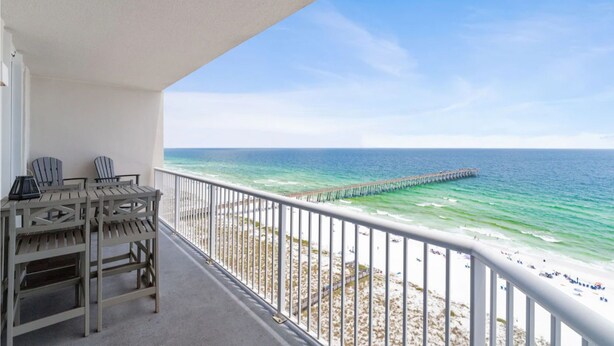 A balcony with a view of the beach and a pier. - Summerwind West 1403 - The Beach Fort (Navarre)