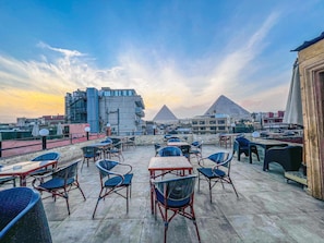 Deluxe Triple Room, Mountain View | Outdoor dining - luxury oriental pyramids inn (Giza)