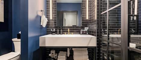 Shower, hair dryer, towels, shampoo