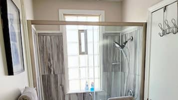 Shower, hair dryer, towels, soap