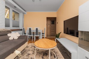 Departamento Confort, balcón | Área de sala de estar
