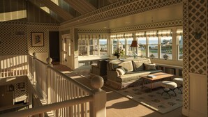 A spacious living room with a high ceiling, large windows, a staircase, and a view of the outdoors. - 2 Queens with Direct Pool Access + Restaurants & Spa (Duck)