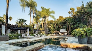 A pool area with lounge chairs, a hot tub, and tropical vegetation. - Gated 7BR Rancho Santa Fe Estate Pool/Guest House (Rancho Santa Fe)