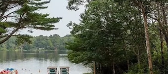 Cozy 2-bedroom cabin with AC. Fun for all ages with pond and pool access.