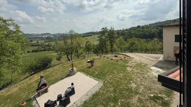 A patio with outdoor seating, a grill, and a view of a hilly landscape. - Cascina Moretta!!! It is a pleasure to have you here in the authentic heart of Monferrato. (Piemonte)