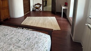A bedroom with a bed, a wooden wardrobe, a desk, and a chair. - Cascina Moretta!!! It is a pleasure to have you here in the authentic heart of Monferrato. (Piemonte)
