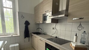 A kitchen with a microwave, oven, and a sink. - Cascina Moretta!!! It is a pleasure to have you here in the authentic heart of Monferrato. (Piemonte)