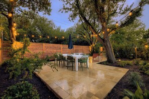 Private backyard dining with café lights, ideal for evening gatherings - Walk to Square | Backyard Oasis + Pool and Sauna (Georgetown)