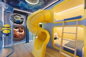 A children's play area with a slide, bunk beds, and a minion-themed wall decoration. - 10 BD/ 8 BA/ Windsor Cay (1003 CR) (Clermont)