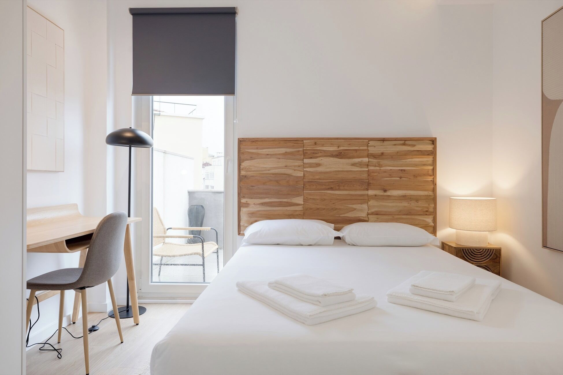 Desk, iron/ironing board, bed sheets