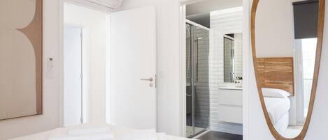 Desk, iron/ironing board, bed sheets
