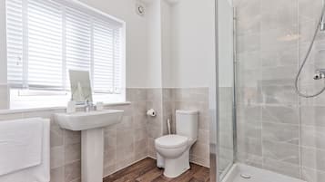 Shower, hair dryer, towels, toilet paper