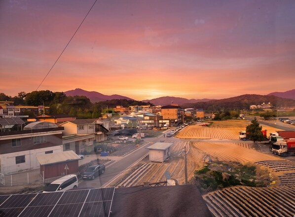 A town with buildings, roads, and solar panels.