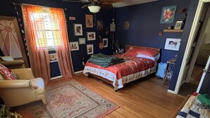 A bedroom with a bed, a chair, a ceiling fan, and a window with curtains. - Beautiful, Family friendly home in Saratoga Springs, NY. 2.2 Miles from track, (Saratoga Springs)