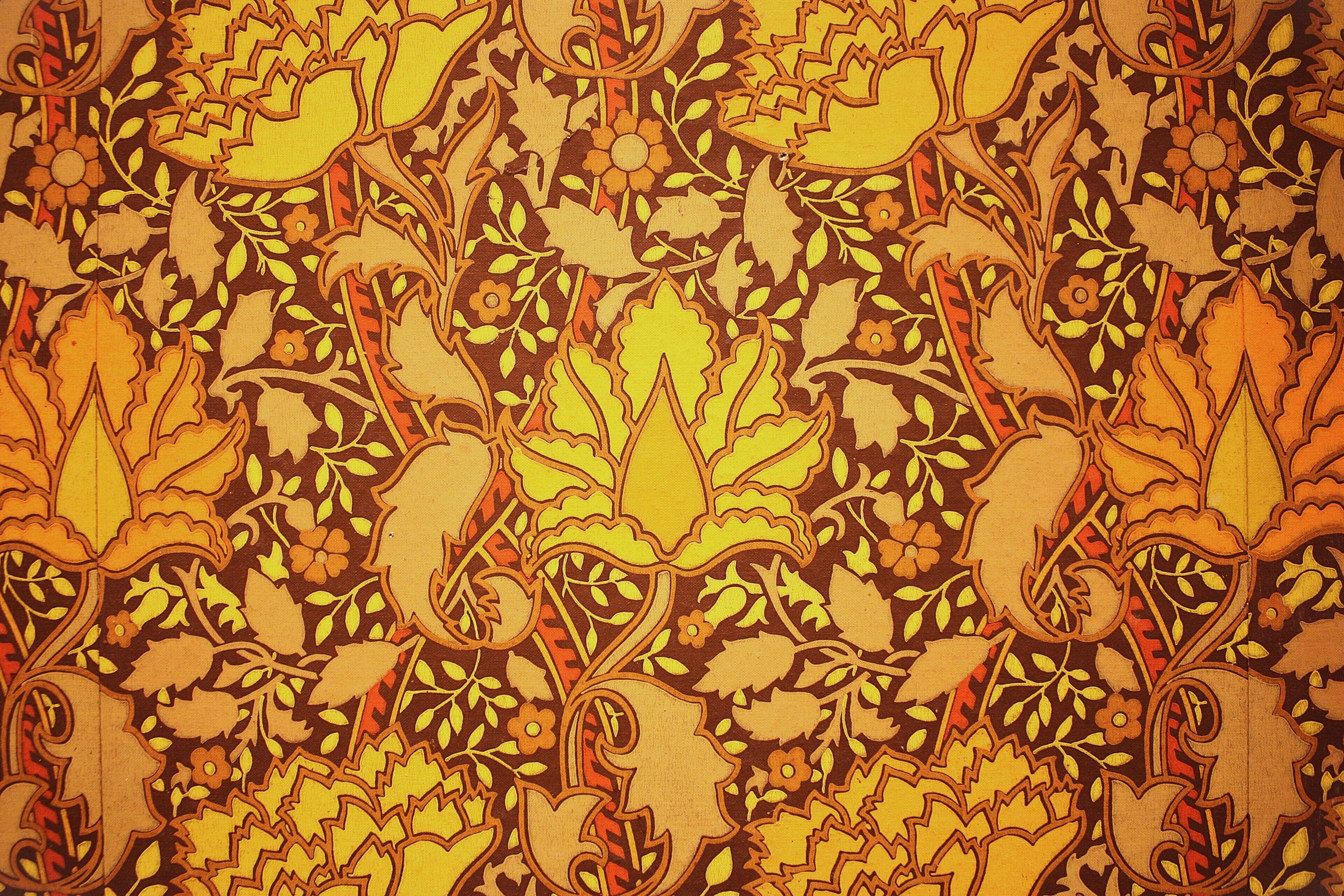 A patterned fabric with floral and leaf designs.