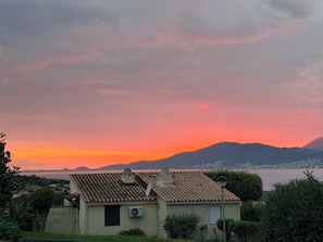 A house with a tiled roof, a satellite dish, and an air conditioning unit. - House Vetta di Sole air-conditioned sea view (Grosseto-Prugna)