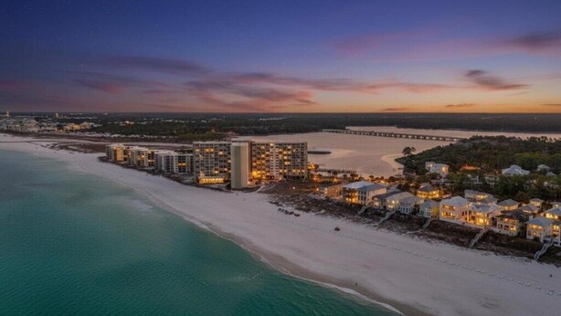A coastal hotel with beachfront rooms, a pier, and a sunset view. - Ocean Views, Pinnacle Port A-108 (Panama City Beach)
