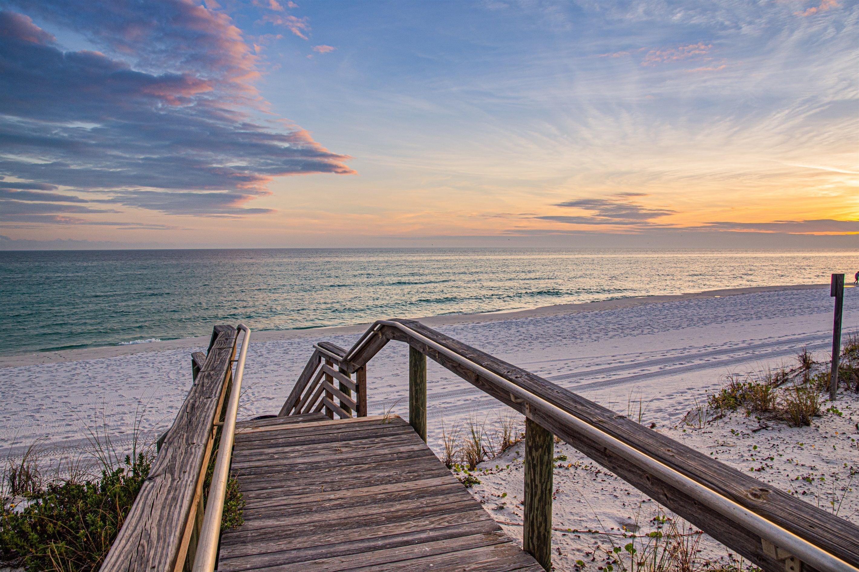 Chase the sunset down this scenic wooden path to the beach ✨ Feel the sand between your toes as you soak in breathtaking views of the sunset.