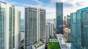 A high-rise hotel with multiple floors, a rooftop pool, and a view of the ocean. - The Club at Brickell Bay (Miami)