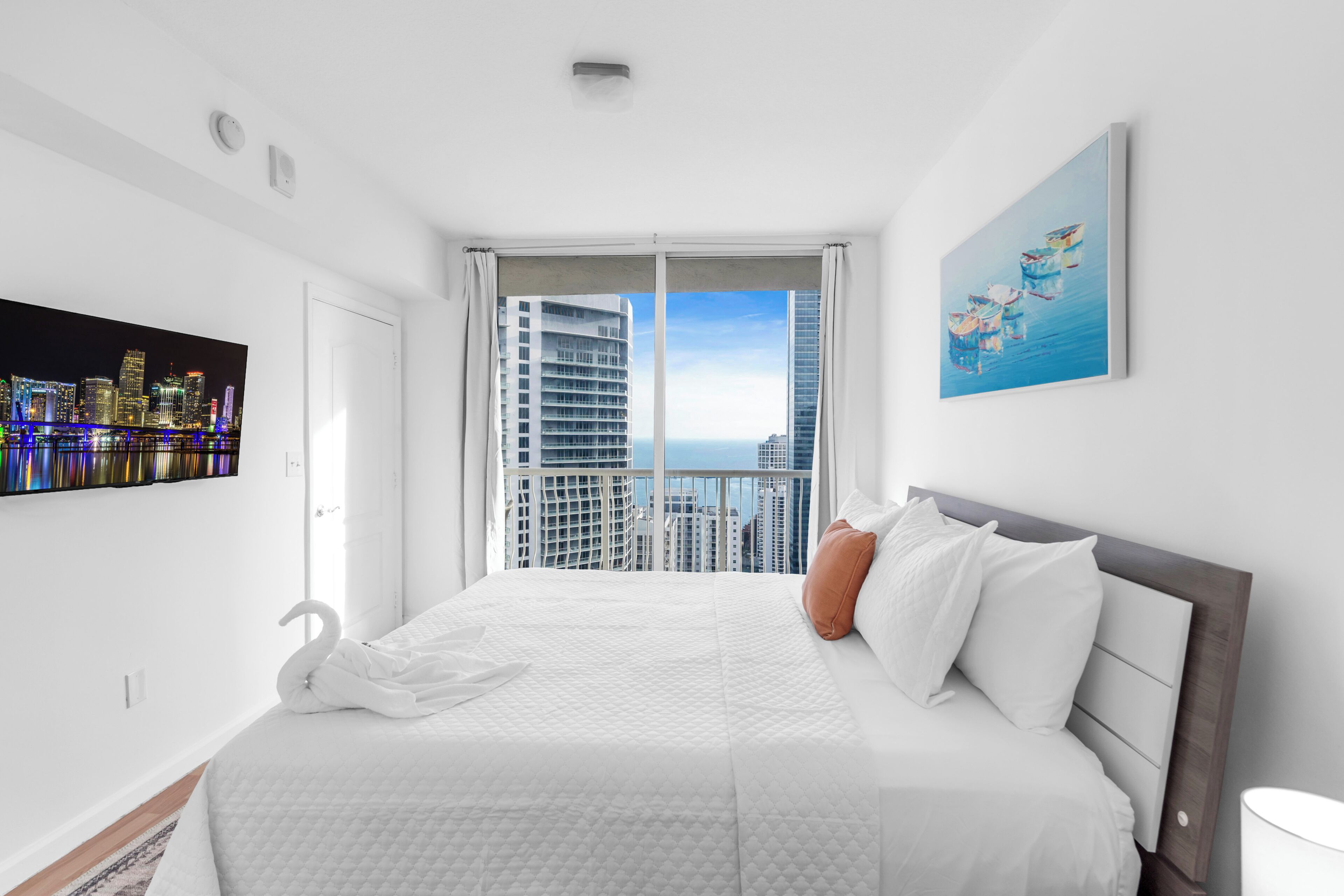 Premium bedding, laptop workspace, blackout curtains, soundproofing