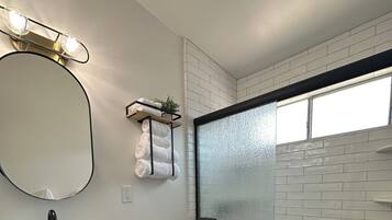 Shower, hair dryer, towels, soap