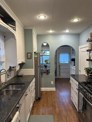 Microwave, oven, stovetop, dishwasher - 3-bedroom house in Waldo Neighborhood of Kansas City with all the vibes. (Kansas City)