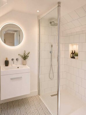 Shower, hair dryer, towels, soap