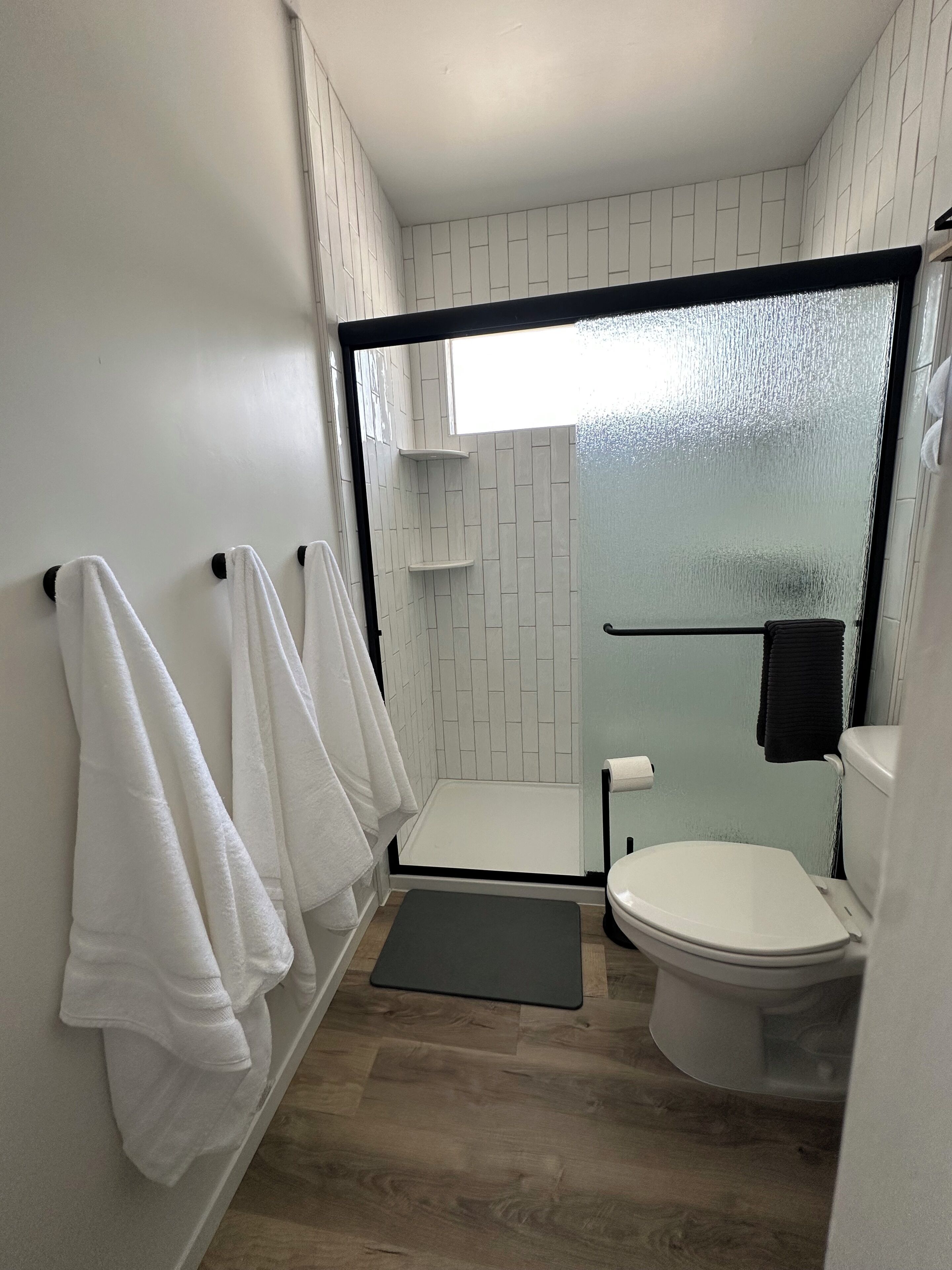 Shower, hair dryer, towels, soap