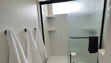 Shower, hair dryer, towels, soap