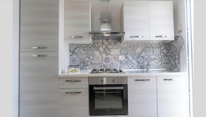 Condo clásico, vista al jardín | Cocina privada