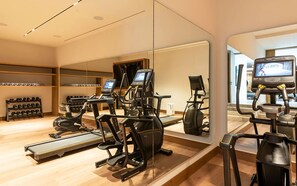 A gym with treadmills, elliptical machines, and a mirrored wall. - Punta Pac Fico 7 in Punta Mita (Punta de Mita)