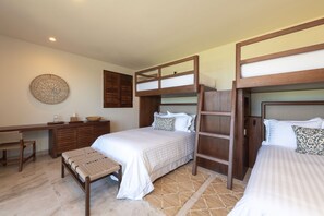 A bedroom with two beds, a desk, and a chair. - Condo N Utica in Punta Mita (Punta de Mita)