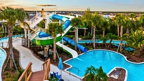 A water park with multiple slides and a pool area. - Upstay Villa w Theater, Game Room, Pool+hot Tub (Davenport)