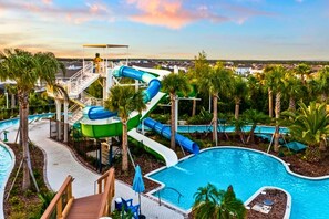 A water park with multiple slides and a pool area. - Upstay Villa w Theater, Game Room, Pool+hot Tub (Davenport)