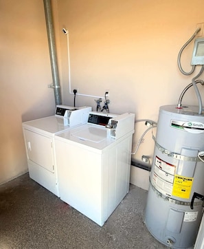 A compact utility room with a white water heater, a control panel, and a water pump. - Radiant Vegas Retreat! Sleeps 6! (Las Vegas)