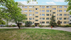 A multi-story building with a flat facade, rectangular windows, and a central entrance. - Royal Baths Spacious Apartment (Warszawa)